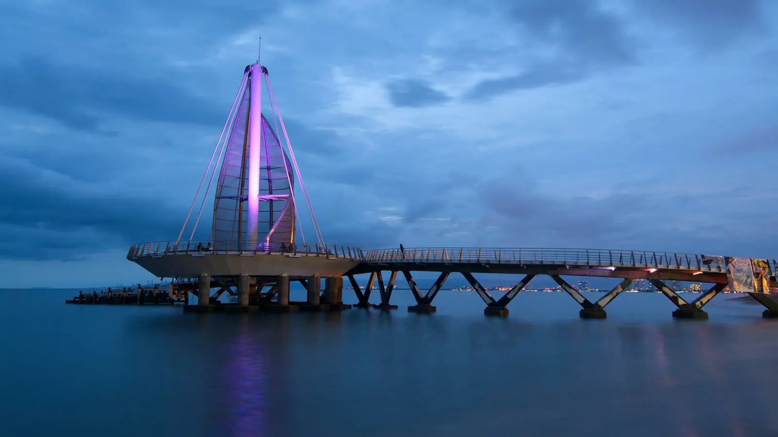 Los Muertos Pier illuminated at dusk in Puerto Vallarta